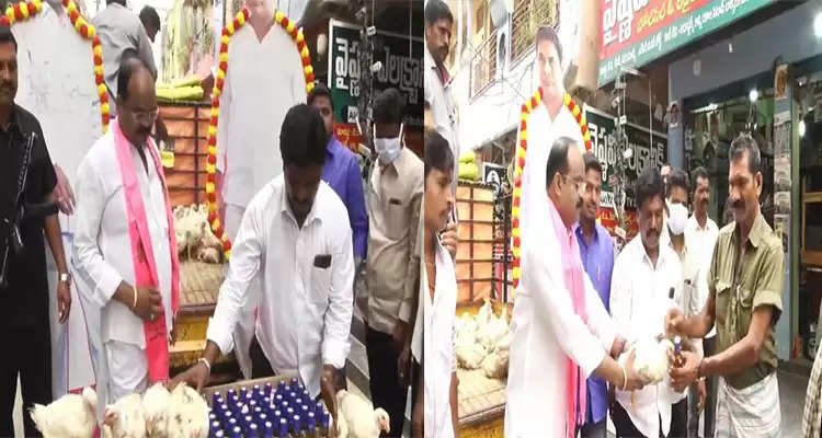 TRS leader Rajanala Srihari distributes liquor bottles and chicken